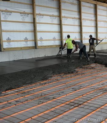 Crew Pouring a Heated Barn Slab